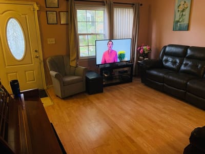 Cozy common area with seating and television