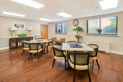 Bright activity room with tables and chairs