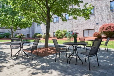 Outdoor seating area with tables and chairs