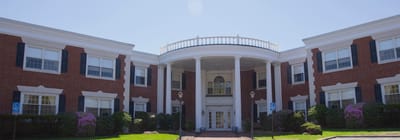 Exterior view of Adviniacare Salem building with gardens
