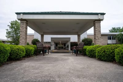 Entrance of Lenawee Medical Care Facility with pathway and landscaping