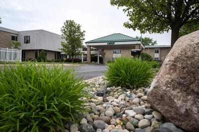 Exterior view of the facility with landscaped garden