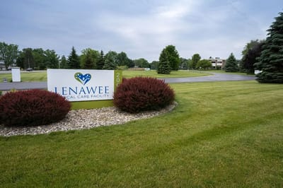 Entrance sign of Lenawee Medical Care Facility with landscaping