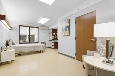 Well-furnished resident room with natural light
