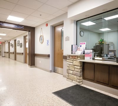 Interior view of a facility reception area with hallways