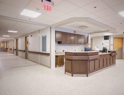 Interior view of a nursing facility hallway and reception area