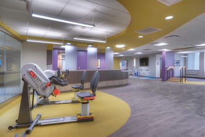 Interior view of a rehabilitation space with exercise equipment