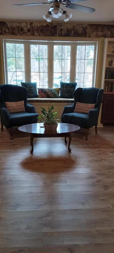 Cozy seating area with plants and large windows