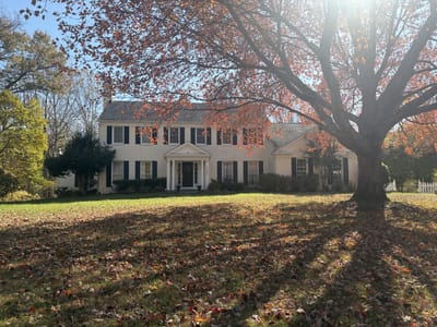 Exterior view of a residential building with autumn leaves