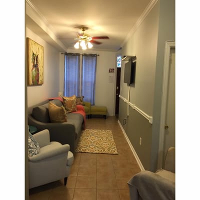 Warm interior common area with seating and decor