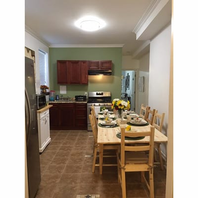A well-decorated kitchen area with a dining table set