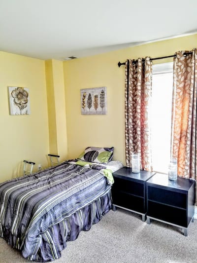 Cozy private room with bed and decor