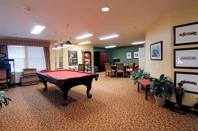 Common area with a pool table and seating