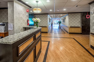 Reception area of a nursing home facility with a front desk