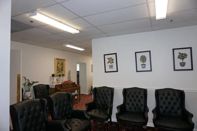Common area with seating and artwork on the walls