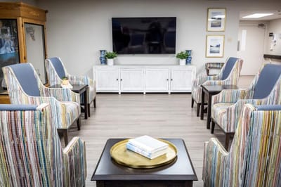 Bright common area with seating and entertainment.