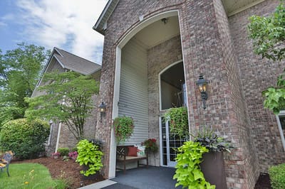 Building entrance with landscaped flowerpots