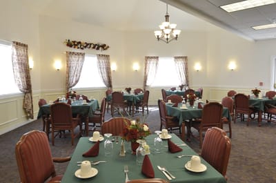Bright dining room with tables set for meals
