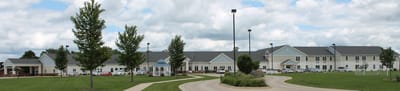 Eberhardt Village, Nursing Home in Arthur, IL — Senior living facility with landscaped grounds and parking area