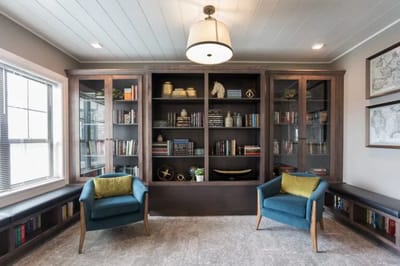 Bright common area with bookshelves and seating