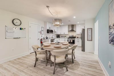Bright dining area with a large table and modern decor