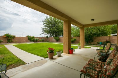 Outdoor patio with seating and garden area
