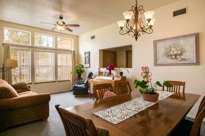 Bright common area with comfortable seating and dining table