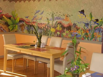 Brightly decorated common area with a dining table