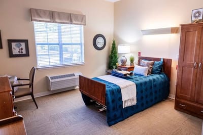 Cozy private resident room with a bed and decor