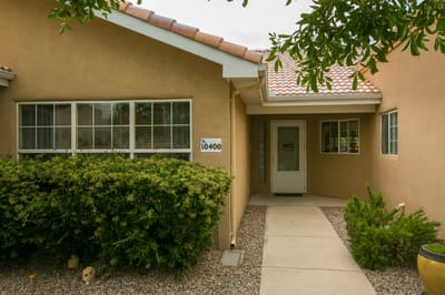 Front entrance of a senior care facility with garden