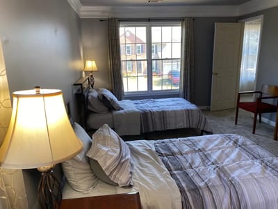 Brightly lit shared bedroom in a senior living facility