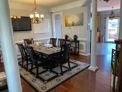 Bright dining area with a large table and chairs