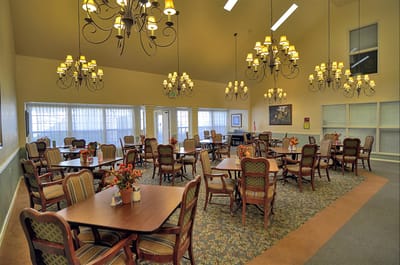 Bright dining room with tables and chandeliers