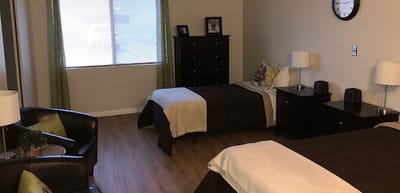 Shared resident room with two beds and furniture