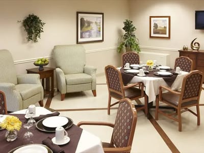 Dining room setup with tables and chairs
