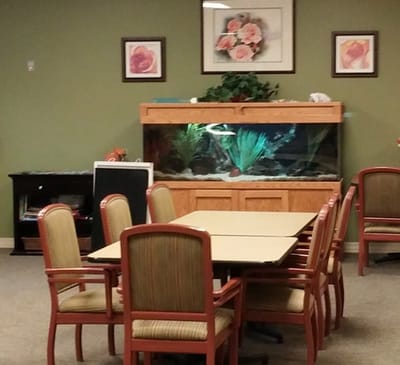 Common area with a fish tank and dining tables