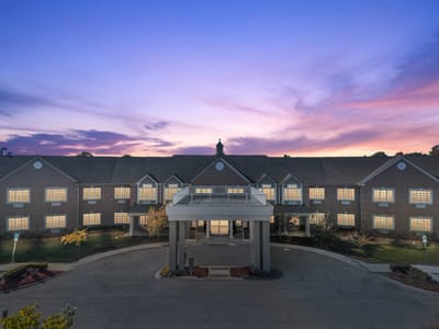 Exterior view of Maple Manor Rehab Center at dusk