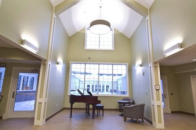 Interior view of a common area with a piano