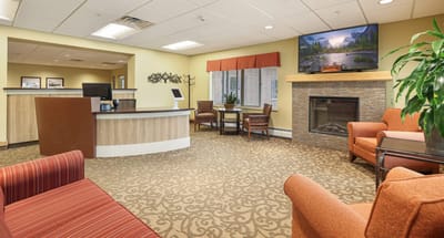 Welcoming common area with seating and fireplace