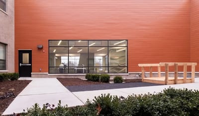 Outdoor area with accessible pathway and seating