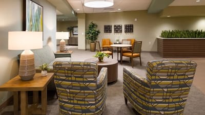 Brightly lit common area with seating and decor