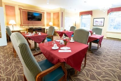 Bright dining area set for a meal with table decor