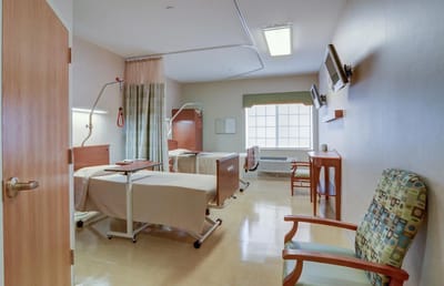 Interior view of a shared resident room with beds