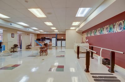 Rehabilitation area with exercise equipment and bright lighting