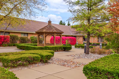 Beautiful outdoor garden with gazebo and colorful flowers