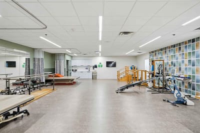 Interior view of a physical therapy room with equipment