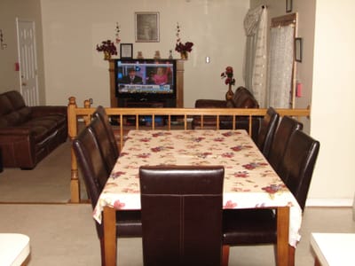 Dining area with a table and chairs in a cozy interior
