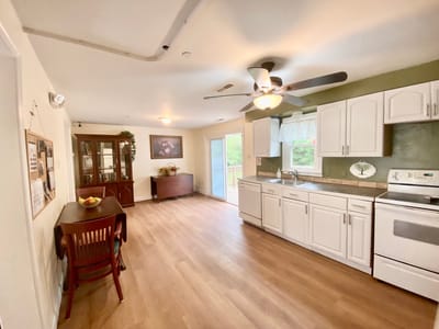 Bright interior kitchen area with wooden floors