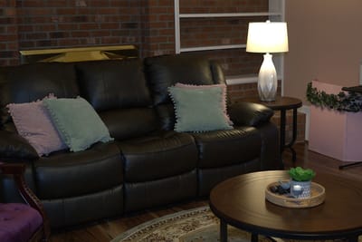 Cozy living room area with a couch and lamp