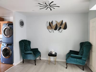Cozy seating area with teal chairs and decor